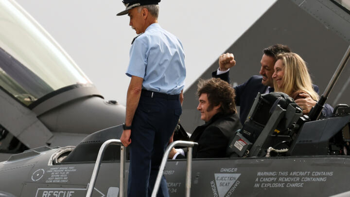 Argentina's President Javier Milei sits in an F-16 Fighting Falcon jet.