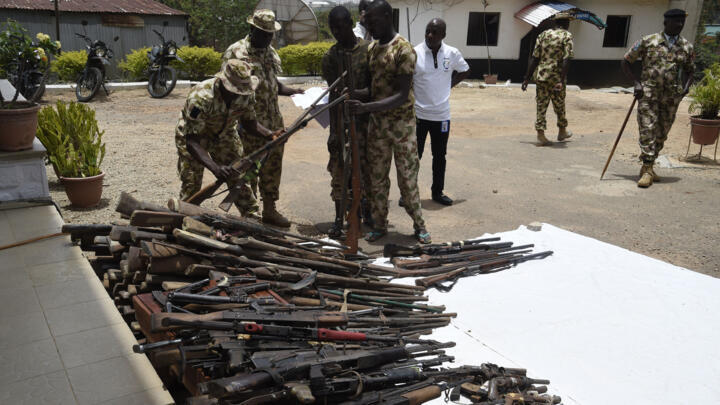A file photo showing Nigerian soldiers making an inventory on April 21, 2022 of small arms and light weapons recovered from bandits.