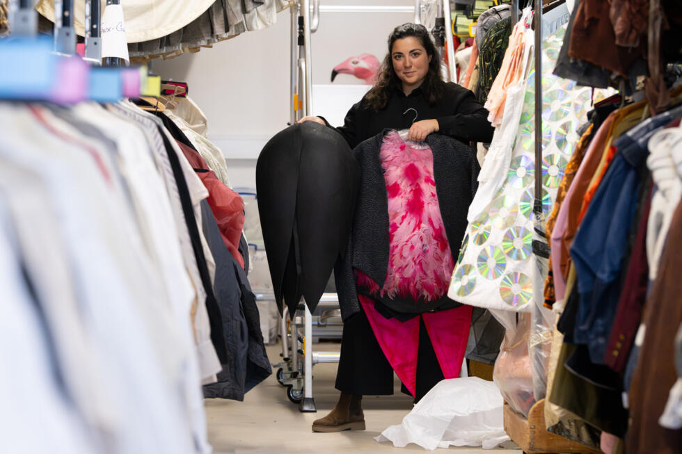 Head of Costume Design Workshops at the Geneva Opera House Sandra Delpierre shows a tailcoat with birds decorated with real pink feathers by Greek director and designer Yannis Kokkos