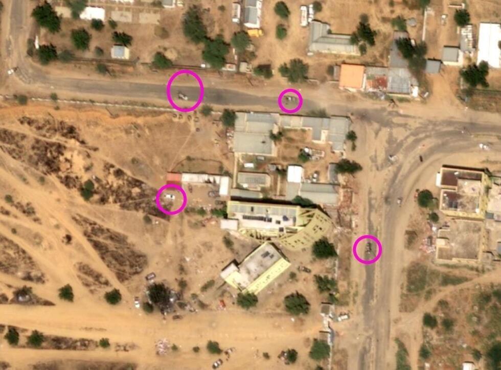 This satellite image from October 27, 2025, shows pick-ups parked near the School of Medicine in El-Fasher, Sudan (geocoordinates: 13.62852, 25.32765).