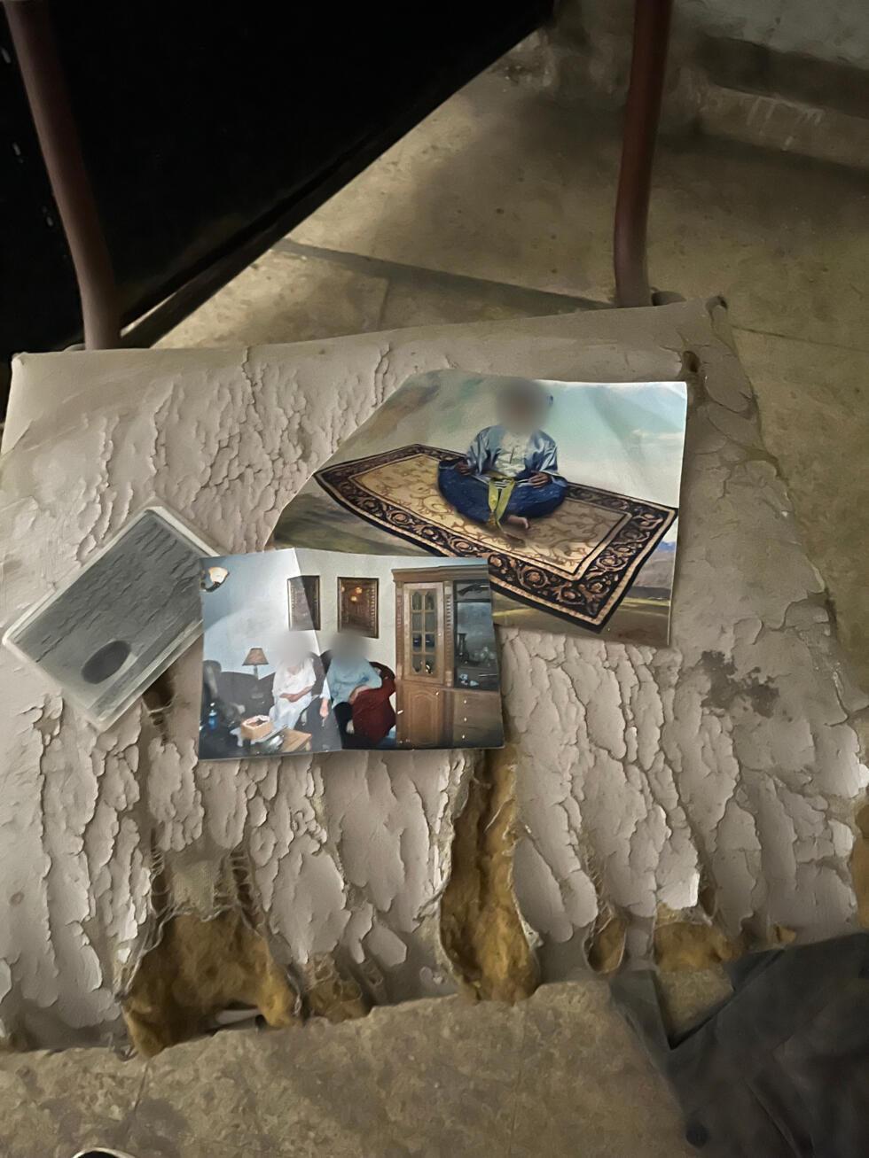 Photos, including one of a child, and an ID card found in the corridors of the Palestine Branch, Damascus, May 29, 2025.