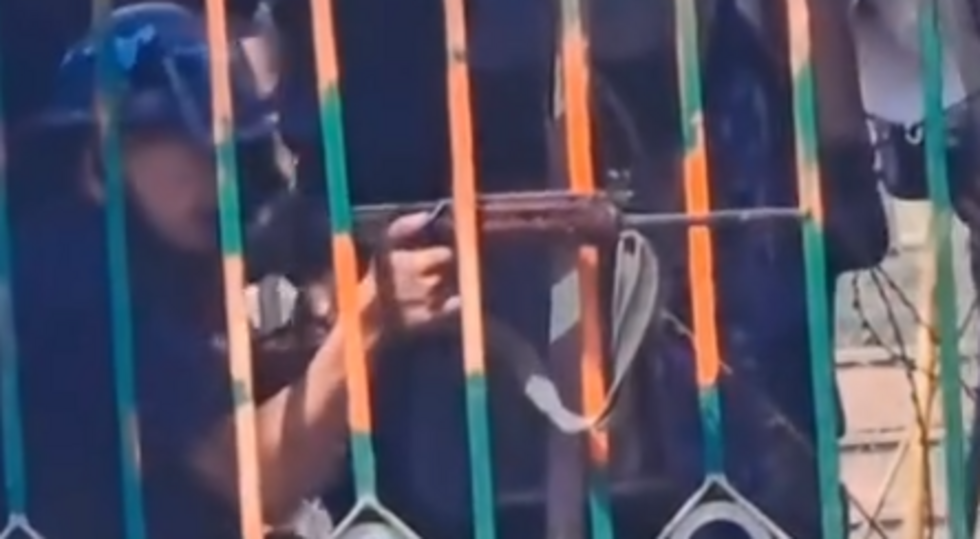 The police firing an assault rifle at the protesters in Kathmandu, in a screenshot from a video posted on Instagram on September 8, 2025.