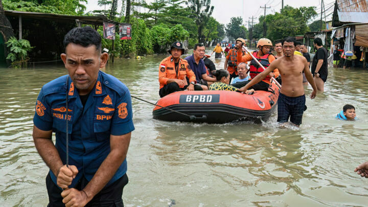Authorities in Indonesia are trying to reach residents cut off by flooding and landslides