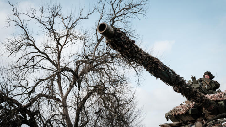 A Ukrainian soldier rides on a battle tank in Bakhmut on February 5, 2023.