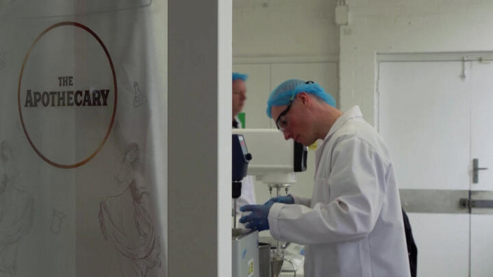 A worker at UK skincare firm Five Squirrels in Brighton, England, on April 18, 2023.