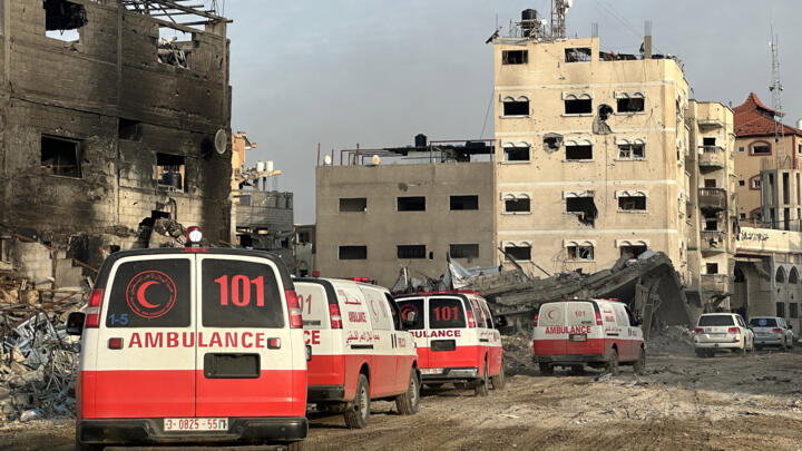 This handout photograph taken on February 18, 2024 by the World Health Organization (WHO) shows a convoy of ambulances during a WHO, UN humanitarian agency OCHA and Palestinian Red Crescent mission to