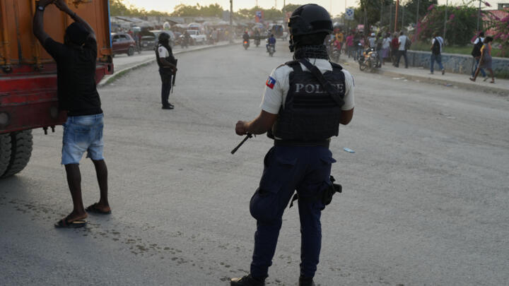 Police officers patrol an intersection in Port-au-Prince, Haiti, September 30, 2025.