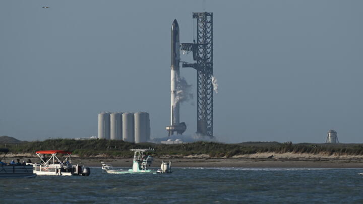The SpaceX Starship rocket stands on the launchpad of the SpaceX Starbase in Boca Chica as seen from South Padre Island, Texas on April 17, 2023.