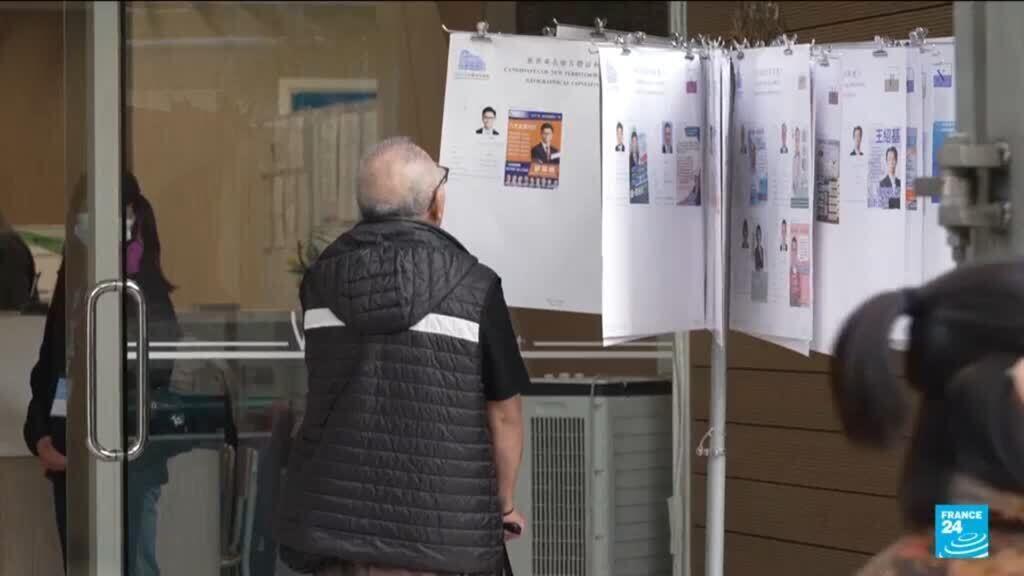 Hong Kong holds tightly guarded election amid anger over deadly fire