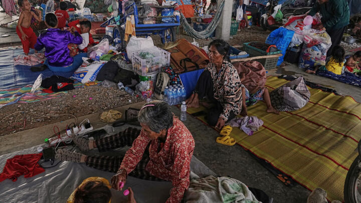 Evacuees take refuge in Banteay Menchey provincial town, Cambodia on December 12, 2025, after fleeings home following fighting between Thailand and Cambodia over territorial claims