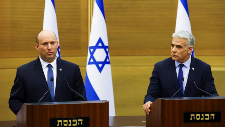 Israeli Prime Minister Naftali Bennett and Foreign Minister Yair Lapid give a statement at the Knesset, Israel's parliament, in Jerusalem, June 20, 2022.