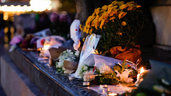Candles and flowers at a makeshift memorial at place de la République to mark 10 years since the November 13, 2015, attacks in Paris.