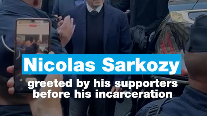 Nicolas Sarkozy greeted by his supporters before his incarceration