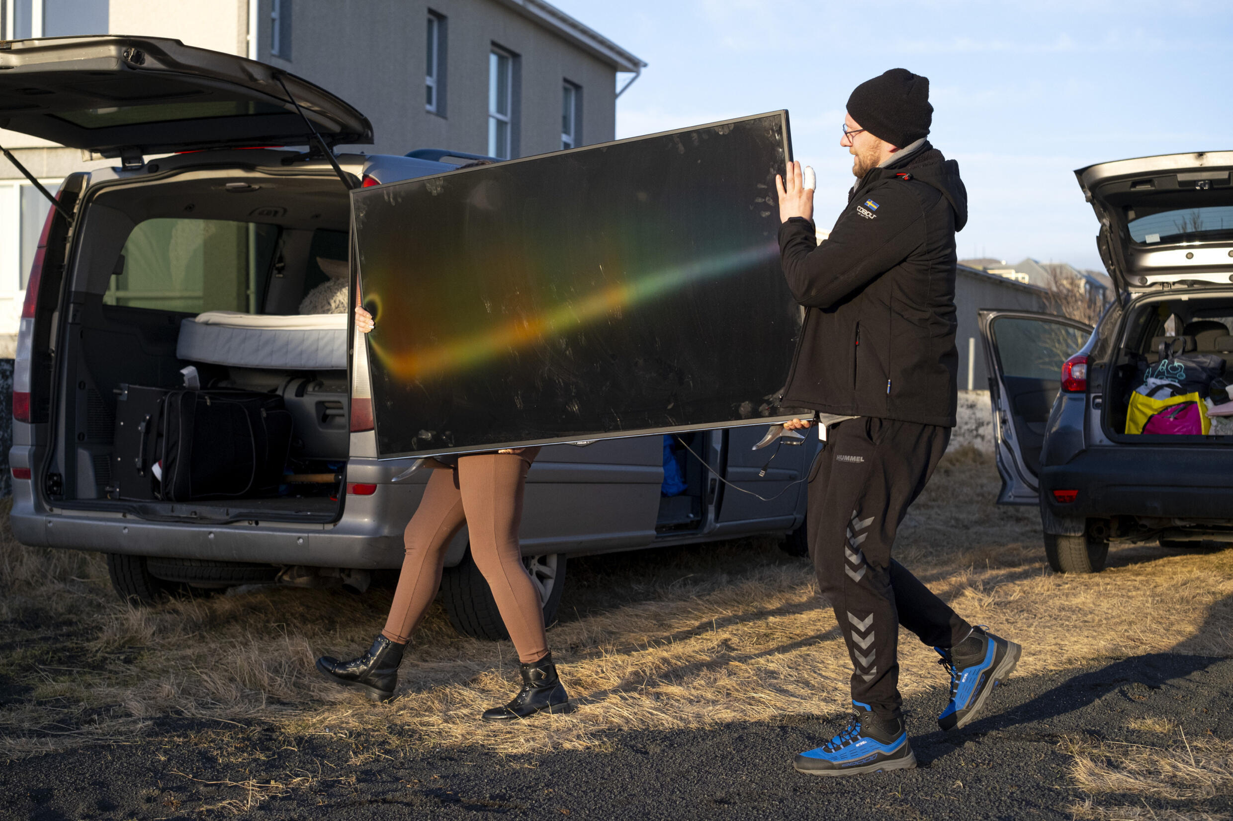 Inhabitants of Grindavik carry out belongings from their homes after a series of tremors have set off a volcano alert