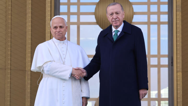 Pope Leo XIV, left, shakes hands with Turkey's President Recep Tayyip Erdogan before their meeting at the presidential palace, in Ankara, Turkey, Thursday, Nov. 27, 2025