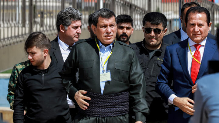 Mazloum Abdi (C), commander-in-chief of the Syrian Democratic Forces (SDF), and Hamid Darbandi (R), envoy of Iraqi Kurdish politician Masoud Barzani (leader of the Kurdistan Democratic Party), attend 