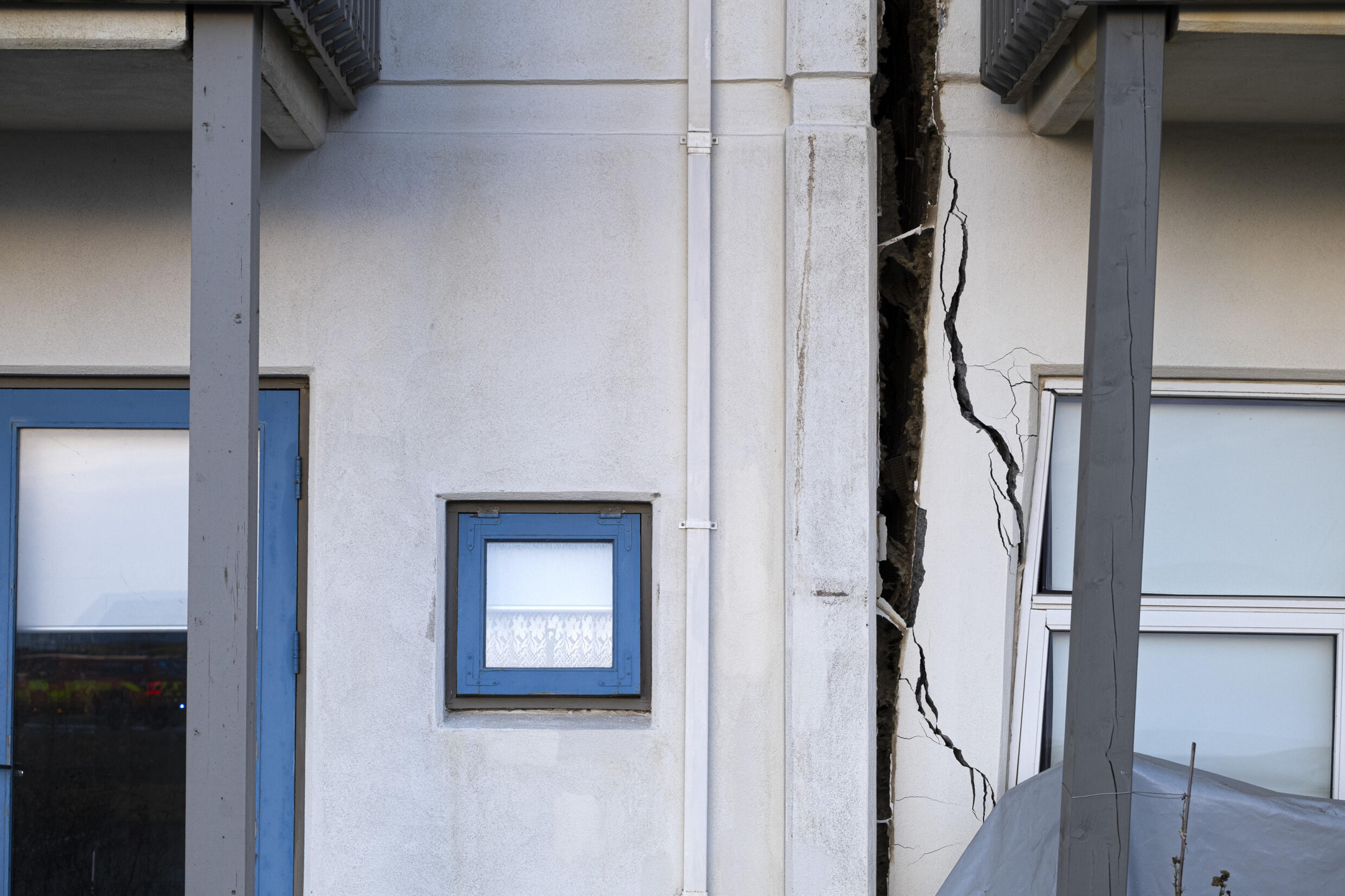 A crack cutting through the front of a house in Grindavik, southwestern Iceland, where earthquakes have heightened fears of a volcano