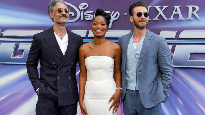 Cast members Taika Waititi, Keke Palmer and Chris Evans pose for pictures as they arrive for the UK premiere of 'Lightyear' in London, Britain, on June 13, 2022.