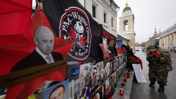 People visit a makeshift memorial for Wagner private mercenary group chief Yevgeny Prigozhin in central Moscow on February 23, 2024, 6 months after his death.
