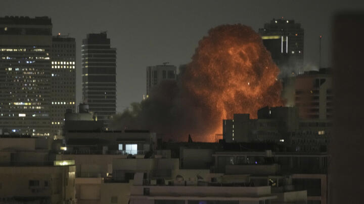 An explosion is seen during a missile attack in Tel Aviv, Israel, on June 15, 2025.