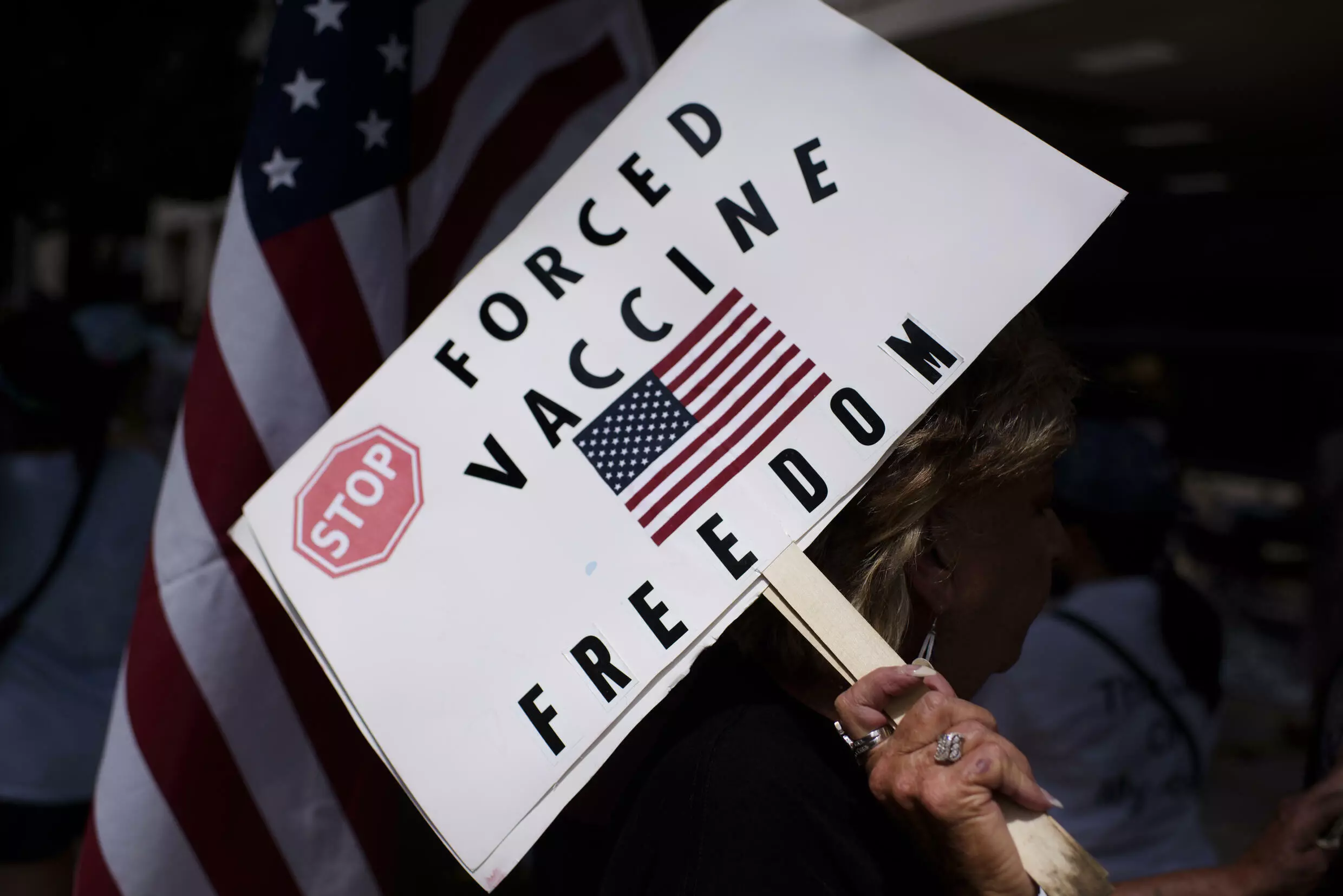 Anti-vaccine rally protesters hold signs outside of Houston Methodist Hospital in June 2021 - employees had sought to overturn a vaccine mandate, but their case was dismissed in a federal court