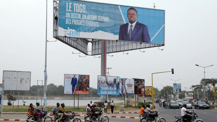 A billboard of Togo’s President Faure Gnassingbe is seen above a street in Lome in this photo taken on February 19, 2020. 