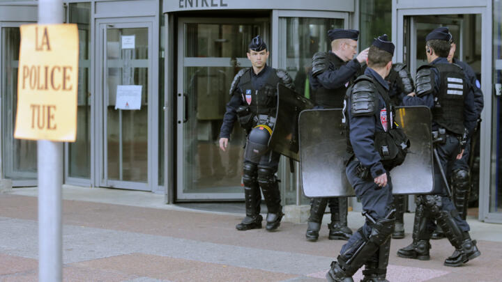 Police stand guard outside the courthouse in Bobigny, suburban Paris, France, Monday May 18, 2015.