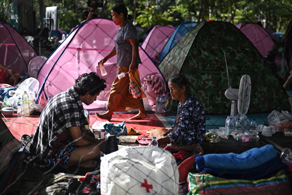 Displaced residents rest at an evacuation center in the Thai border province of Surin during clashes along the Thai-Cambodia border.