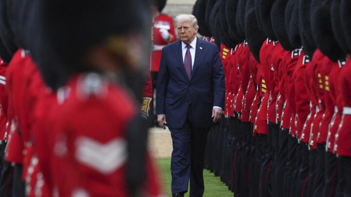 US President Donald Trump inspects the guard of honour during a welcoming ceremony in the courtyard of Windsor Castle on 17 September 17, 2025.