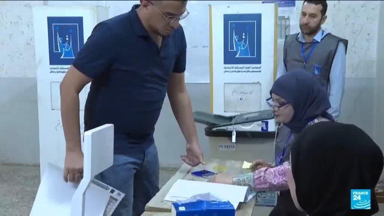 Iraqis vote in a parliamentary election marked by tight security and a political boycott