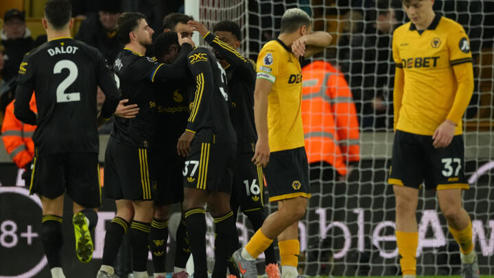Manchester United players celebrate after a goal during the Premier League soccer match between Wolverhampton Wandere and Manchester United in Wolverhampton, England Monday, Dec. 8, 2025.