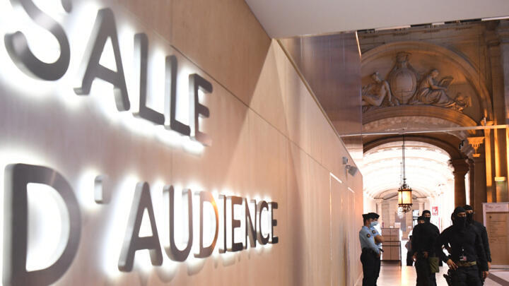 Security forces patrol outside the temporary courtroom set up for the trial of the November 13, 2015 Paris attacks' defendants at the Palais de Justice of Paris.
