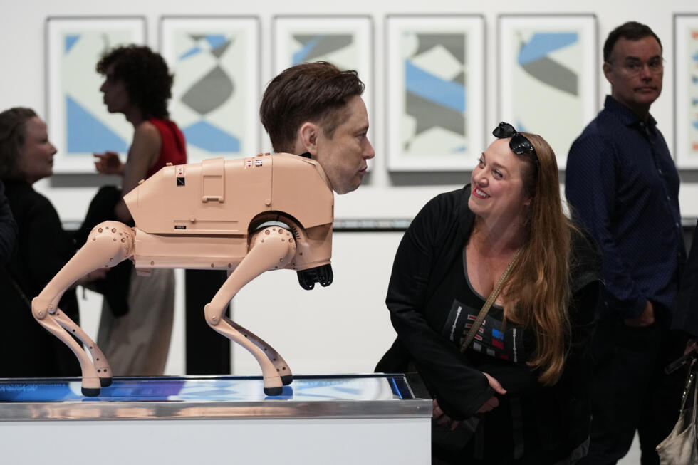 A visitor enjoys herself in front of a robot dog modelled on Elon Musk, in the installation entitled Regular Animals by artist Beeple at Art Basel Miami Beach.