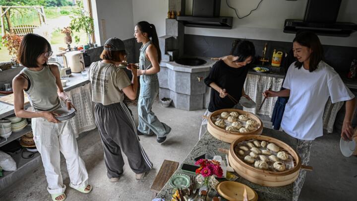 Chen Yani eats lunch with friends and guests at her women's co-living space, 'Keke's Imaginative Space', in Hangzhou.