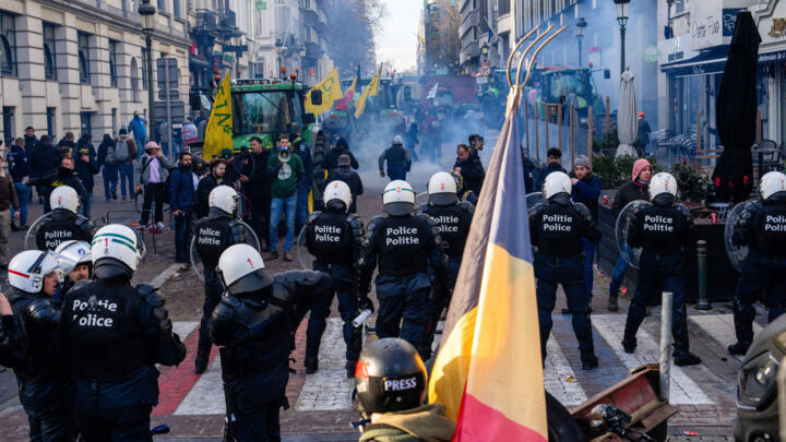 Farmers were locked in a tense standoff with riot police near the European Parliament in Brussels on December 18, 2025.