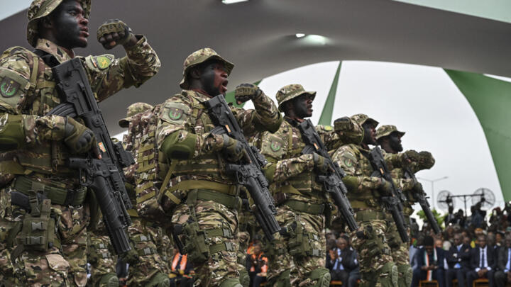 Members of the Ivory Coast Armed Forces march during a military parade marking the 65th anniversary of Ivory Coast independence in Bouake on August 7, 2025.