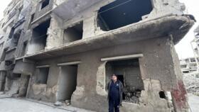 Mohamar Ouda in front of his devastated home in Yarmouk on January 4, 2024.