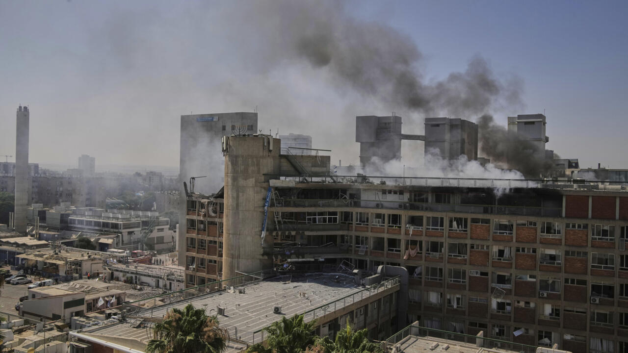 Smokes rises from a building of the Soroka hospital complex after it was hit by a missile fired from Iran in Beersheba, Israel, Thursday, June 19, 2025. (AP Photo/Leo Correa)