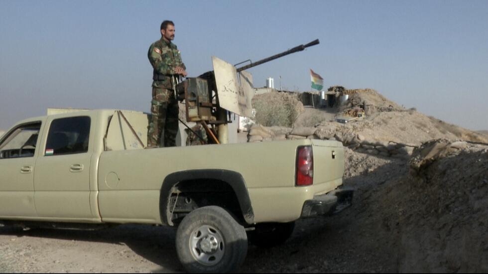 In this Sept. 5, 2016 photo, militiaman of the Kurdistan Freedom Party, an Iranian Kurdish opposition group, stands on a section of the frontline near the Iraqi city of Kirkuk.