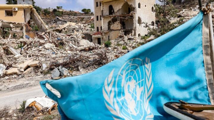 A United Nations flag flies from an armoured vehicle of the UN Interim Force in Lebanon (UNIFIL)  in southern Lebanon near the border with northern Israel on August 27, 2025.