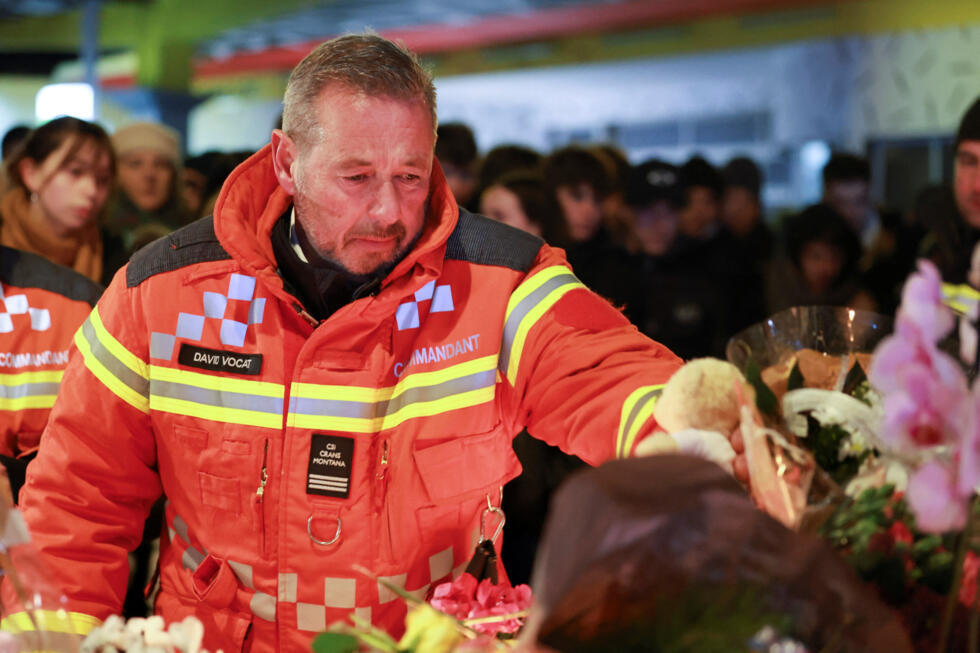 Commander of the Rescue and Fire Department at ACCM David Vocat leaves a teddy bear outside the "Le Constellation" bar.