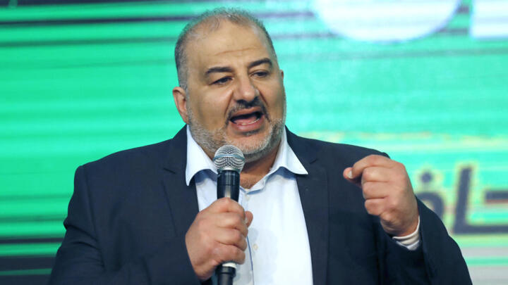 Mansour Abbas, head of the conservative Islamic party Raam, addresses supporters at his campaign headquarters in the northern Israeli city of Tamra on March 23, 2021.