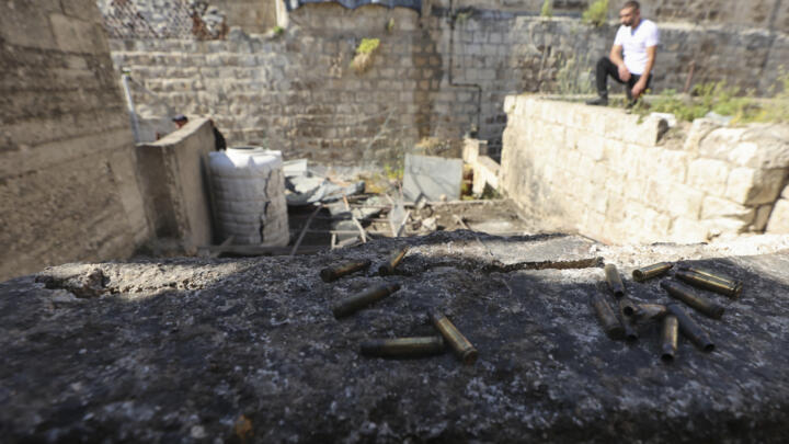 Bullet casings are seen at the site where three Palestinians were killed during an Israeli raid in the occupied West Bank city of Nablus on May 4, 2023.