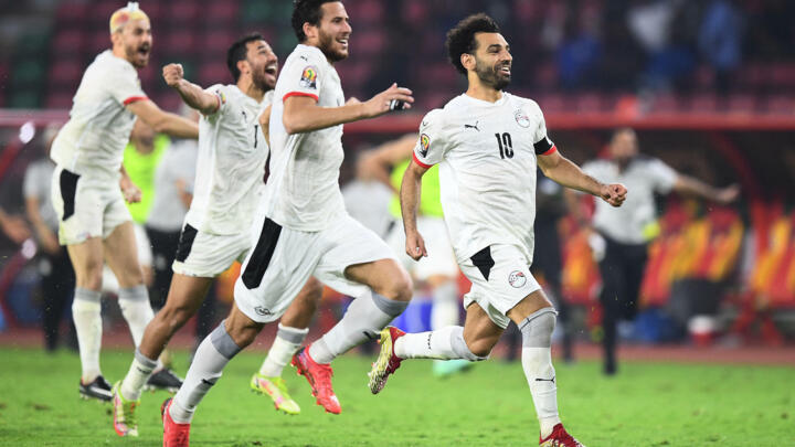 Egypt's players celebrate after winning the Africa Cup of Nations (CAN) 2021 semi-final football match between Cameroon and Egypt at Stade d'Olembe in Yaounde on February 3, 2022.