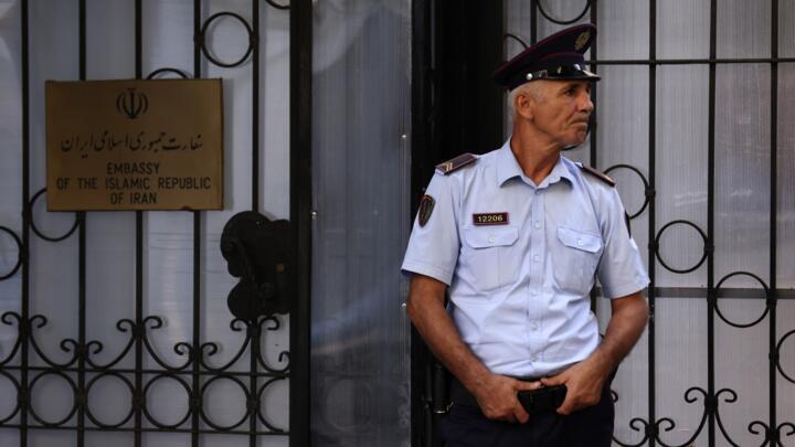 A policeman stands guard outside the Iranian Embassy in Tirana, Albania, Wednesday, Sept. 7, 2022.