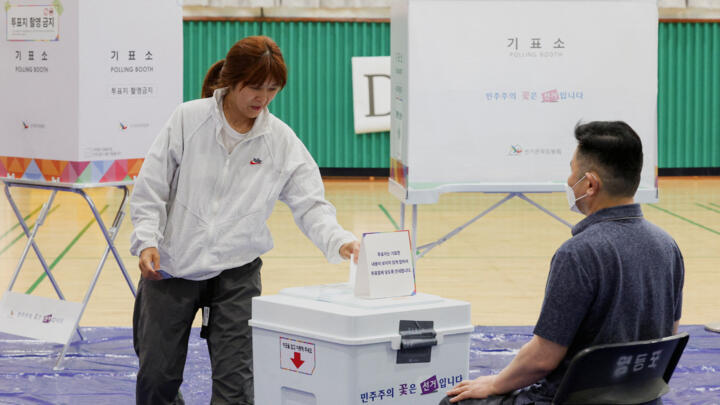 A person casts their vote during the presidential election in Seoul, South Korea, June 3, 2025. 