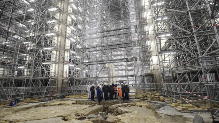 France's Culture Minister Roselyne Bachelot (C) visits the Notre-Dame Cathedral archaeological site after the discovery of a 14th century lead sarcophagus in Paris on March 15, 2022.