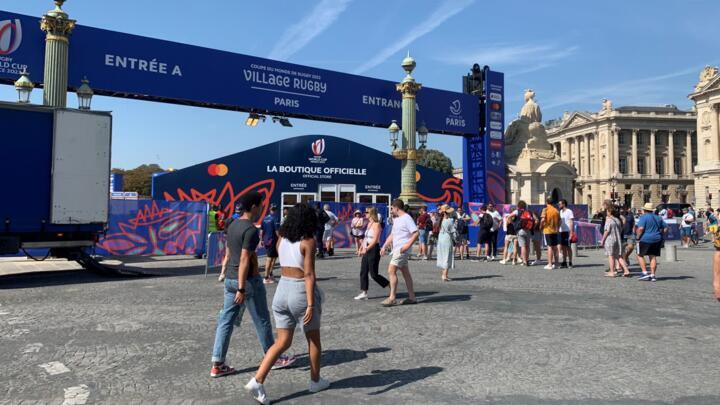 Rugby supporters line up to enter the "Rugby Village" at Place de la Concorde in Paris on September 9.