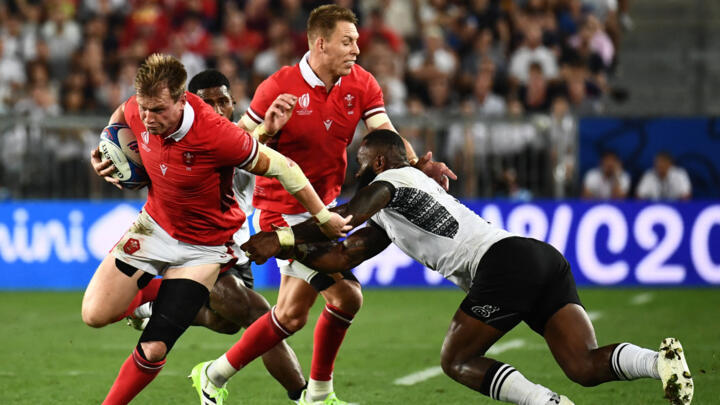 Wales' inside centre Nick Tompkins (L) during the France 2023 Rugby World Cup Pool C match between Wales and Fiji at Stade de Bordeaux in France on September 10, 2023. 