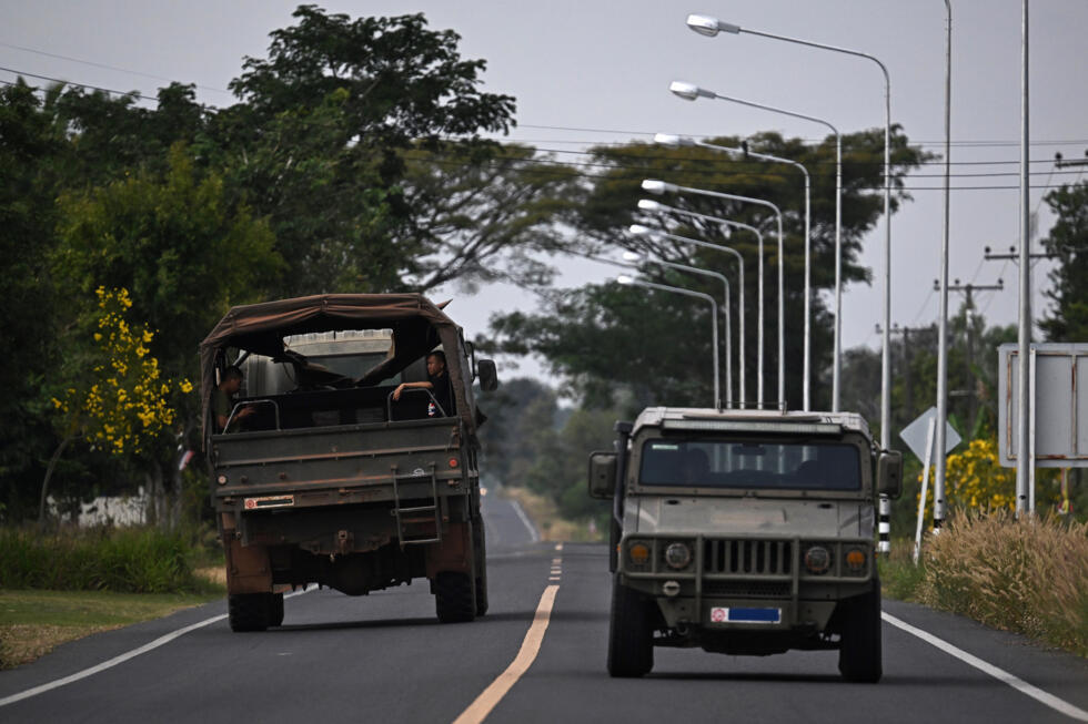 Military vehicles on a road in the Thai border province of Surin